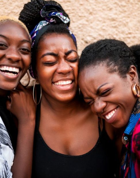 Three beautiful women laughing